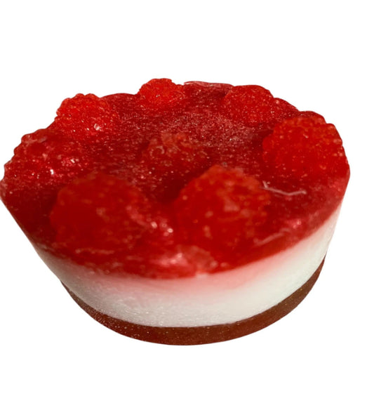 Red cake dessert soap with a white base on a white background